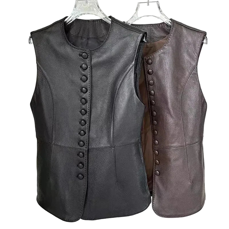 Two leather vest gowns hanging on clear plastic hangers against a light gray background. The vest on the left is black with a dark button closure, and the vest on the right is brown with a brown button closure.