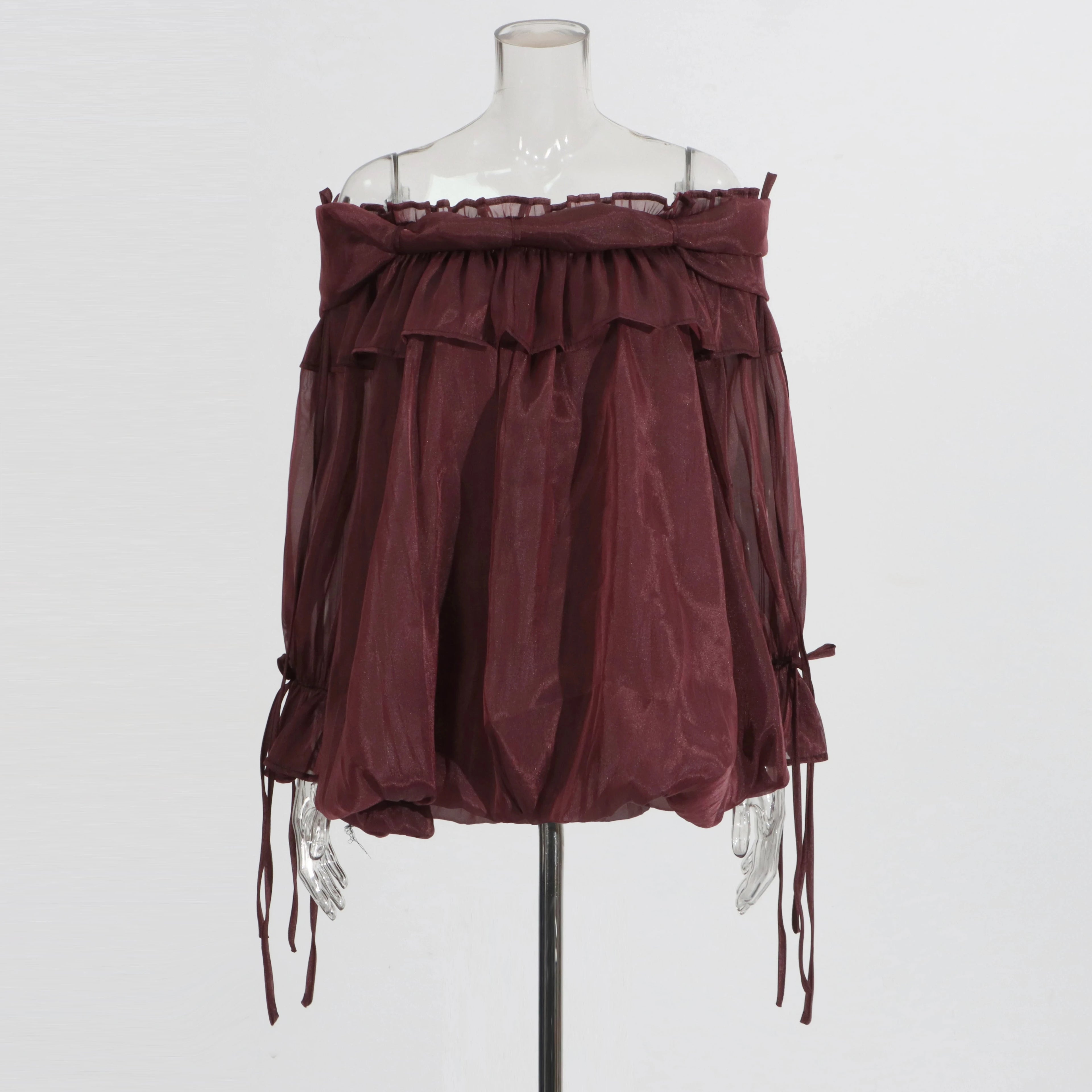 Wine Red off-shoulder top on a mannequin against a white background