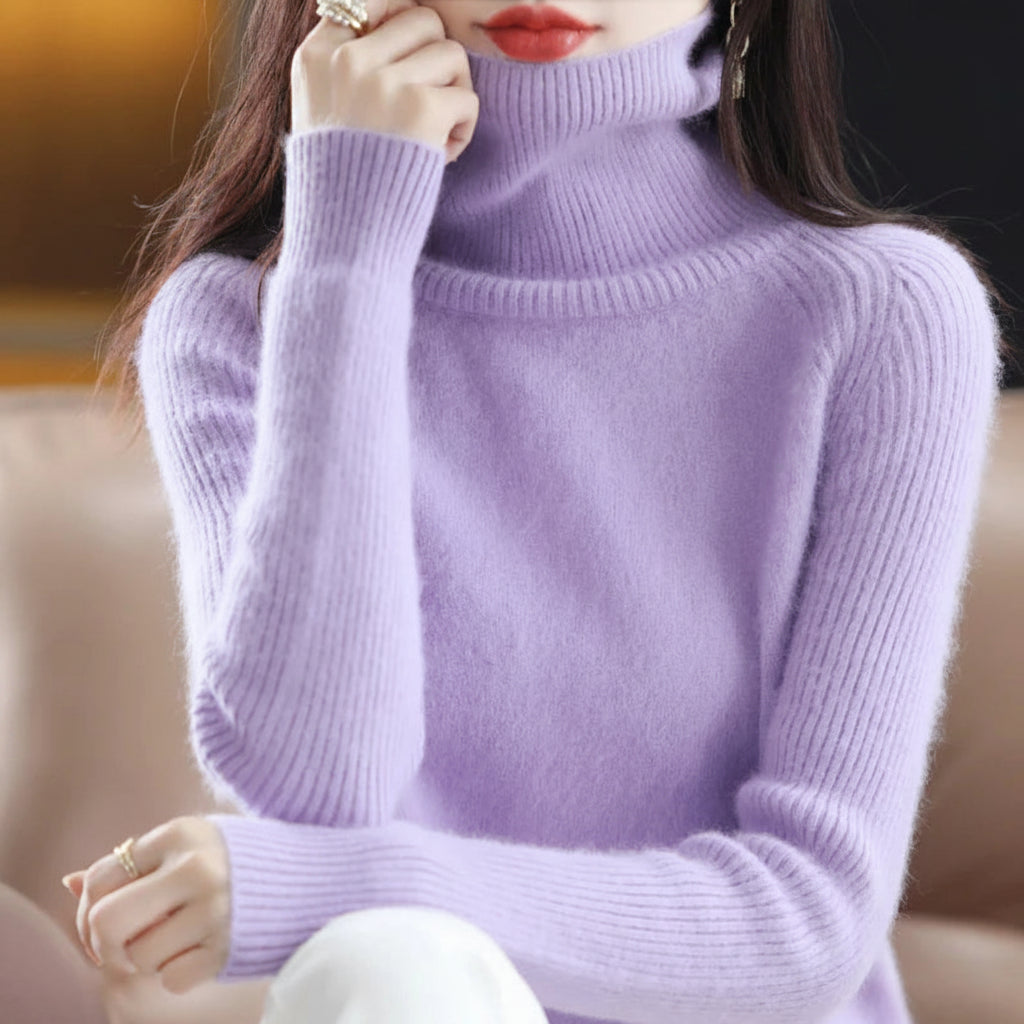 A woman wearing a light purple ribbed turtleneck sweater.