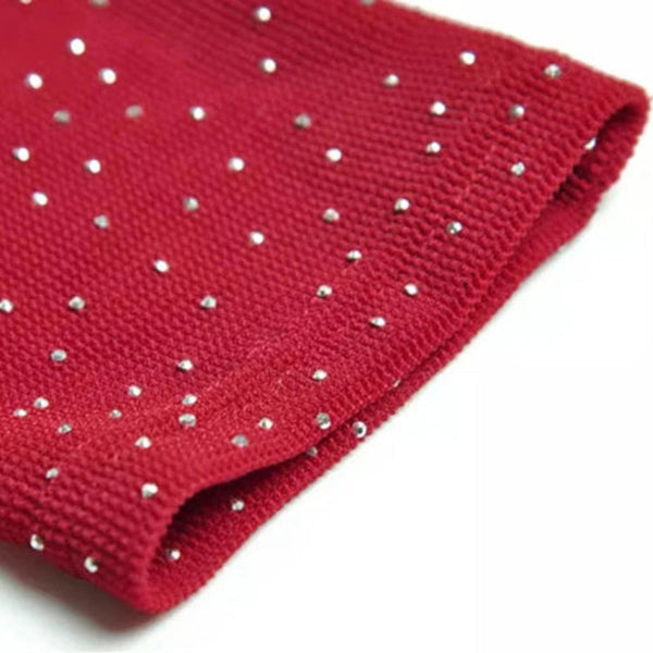 Red fabric with metal studs on a white background