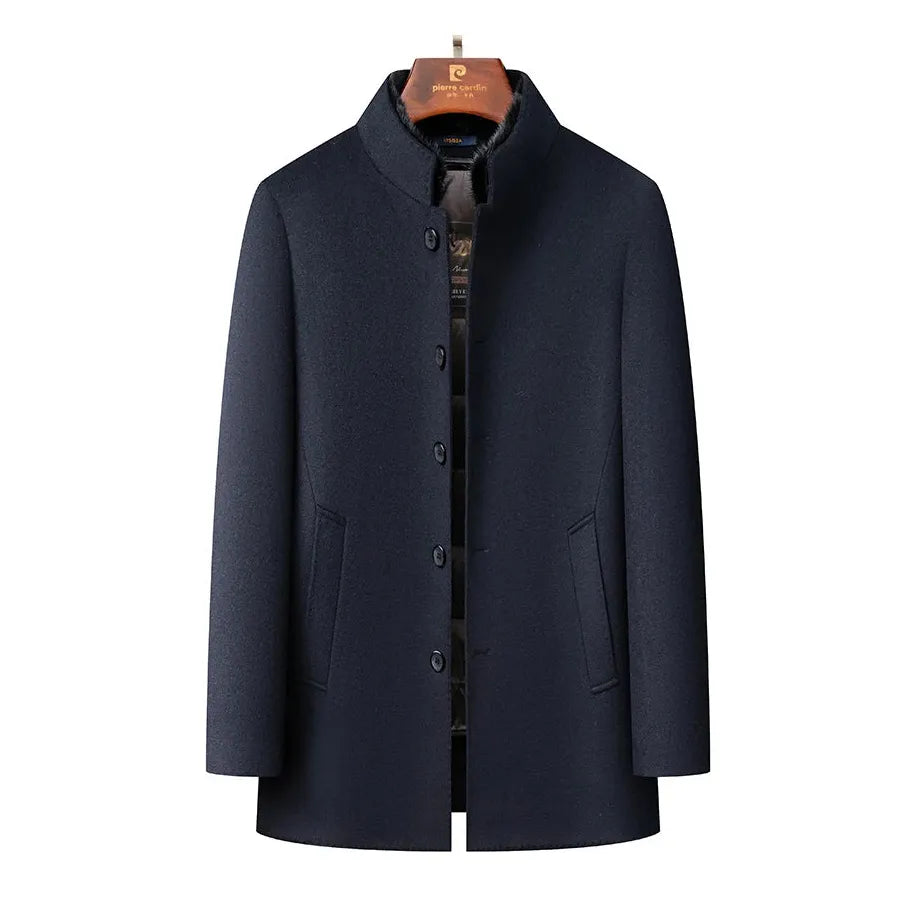 Black wool coat for men mock neck hanging on a hanger close up view with a white background