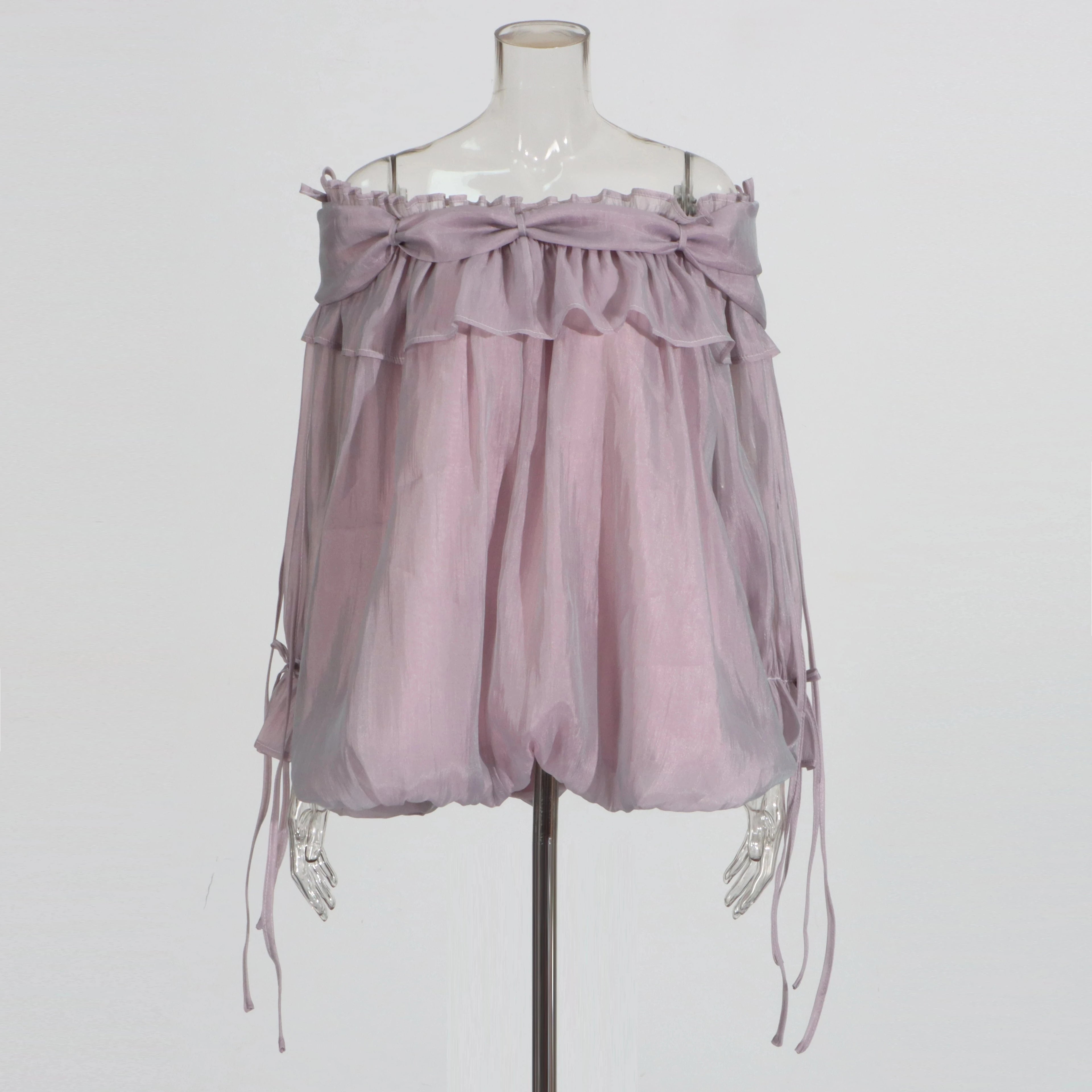 Light purple off-shoulder top on a mannequin against a white background