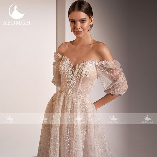 Sherlyn A-Line Beach Wedding Dress 2022 Strapless Off The Shoulder Half Sleeve Beaded Lace Shiny Beading - Frimunt Clothing Co.